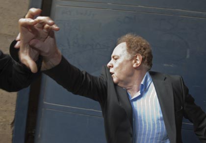Alan Rosenberg of the Church of Scientology Paris, pushes back reporters as he leaves court. Photo: Reuters Alan Rosenberg of the Church of Scientology Paris, pushes back reporters as he leaves court. Photo: Reuters